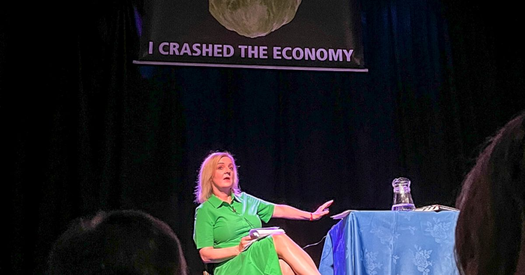 ‘Not Funny!’ Liz Truss Storms Off Stage As Lettuce Stunt Crashes Her ‘Pro-Trump’ Event