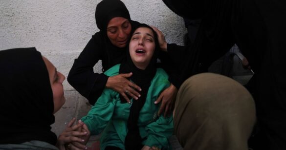Israeli Strikes Kill 52 In Gaza Including Dozens In A Shelter, Medics Say
